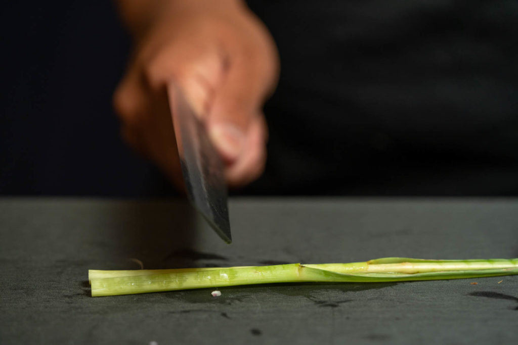 Smash lemongrass (using the back of a knife)