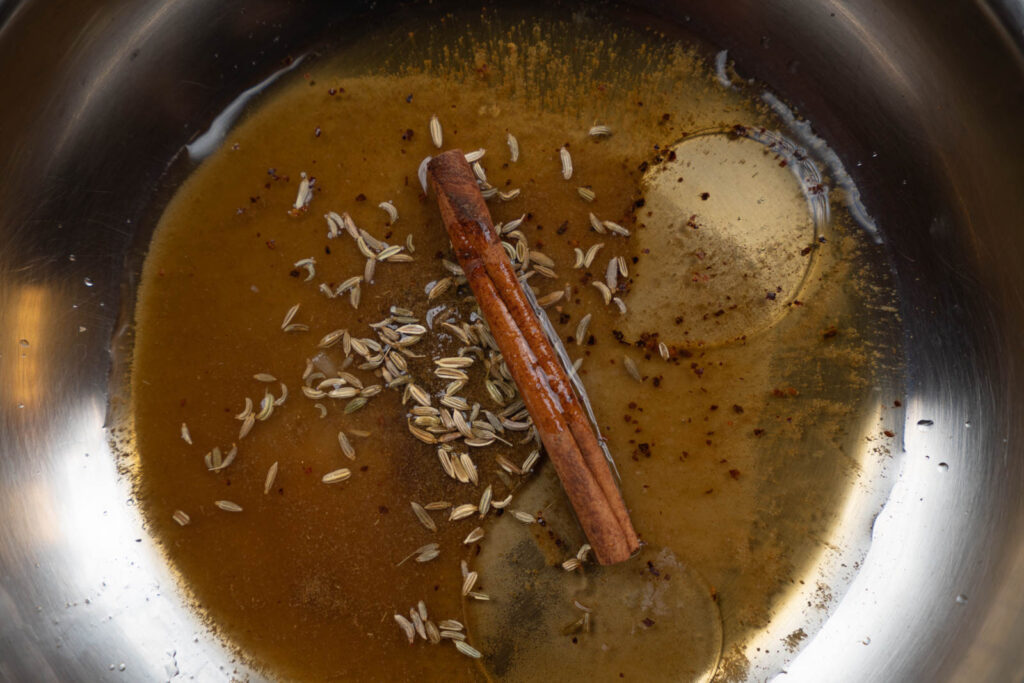 Spices and liquids in a pan