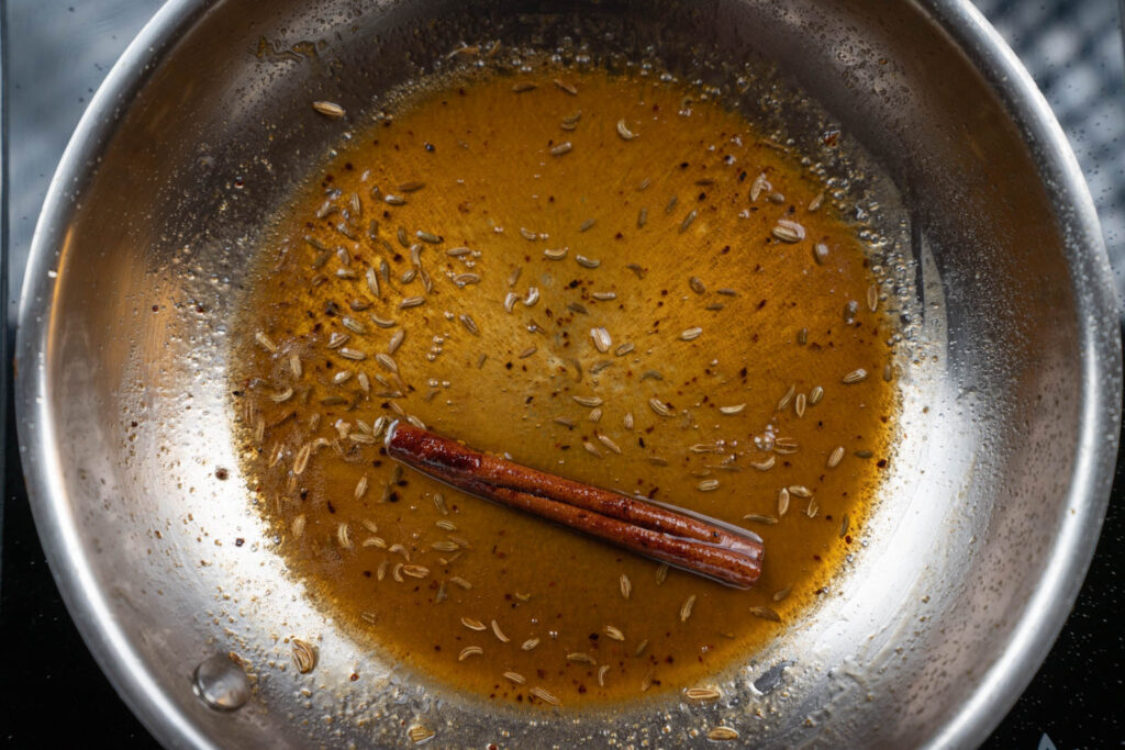 Spices and liquids simmering in a pan