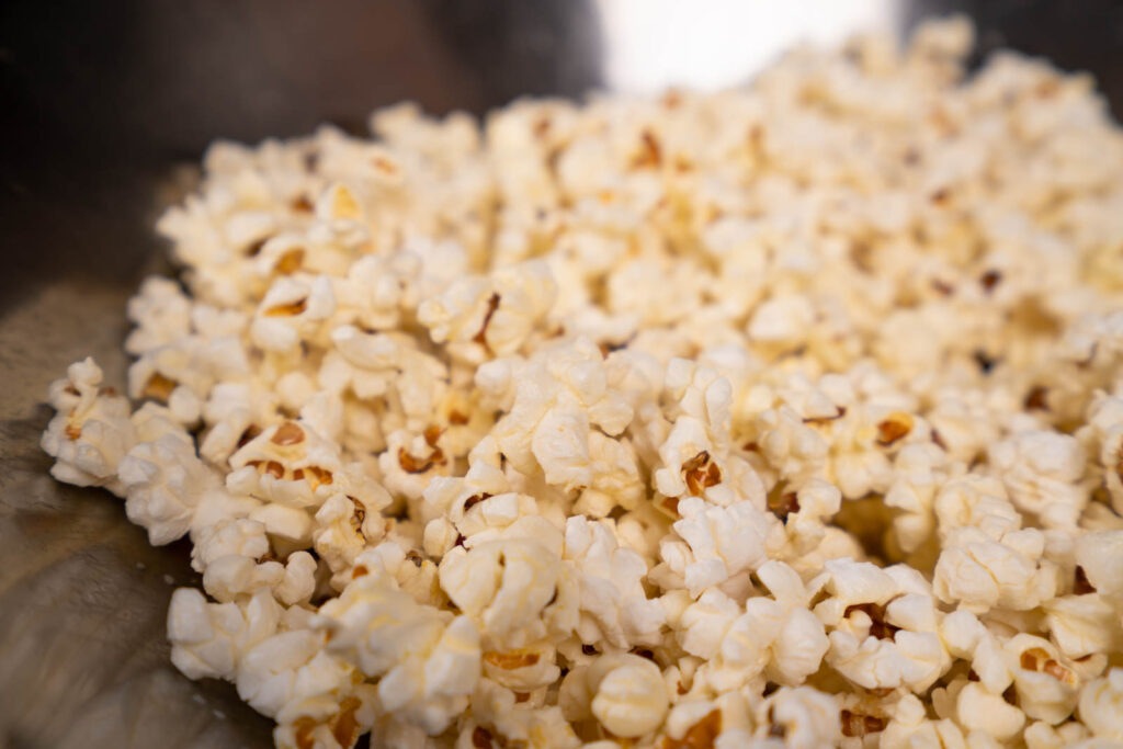 Make popcorn: Add butter to popcorn