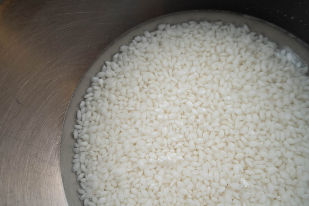 Wash, drain, and soak rice: