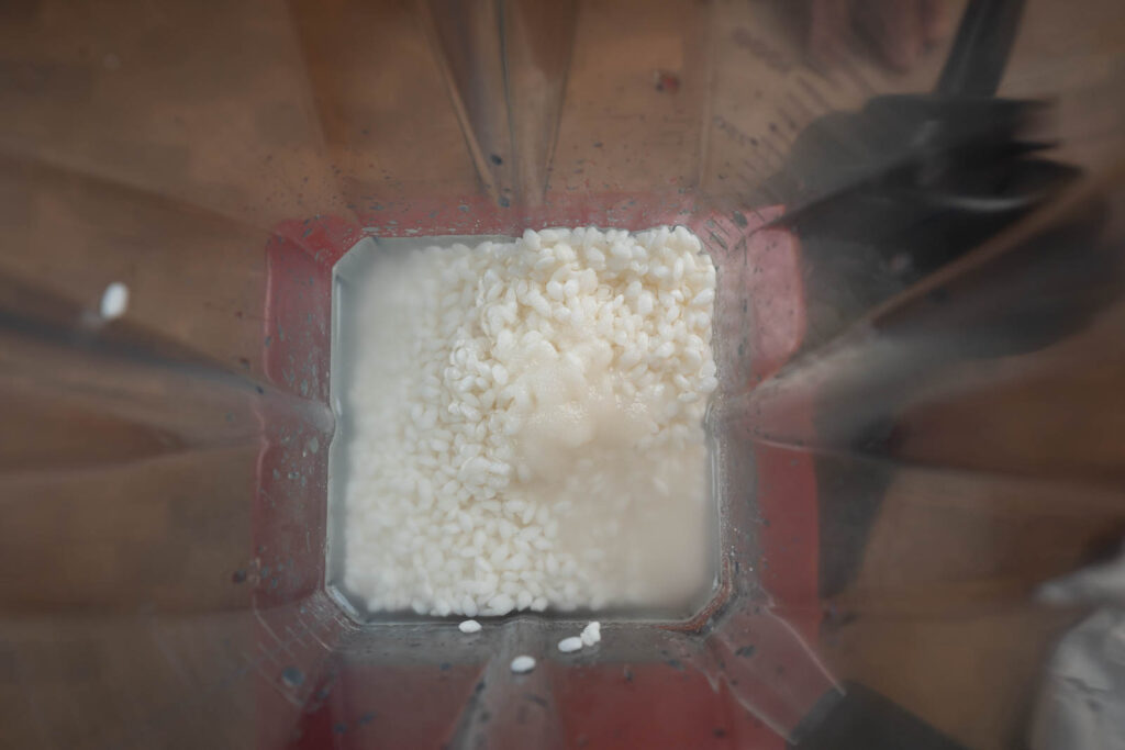 Put rice, water and sugar in blender